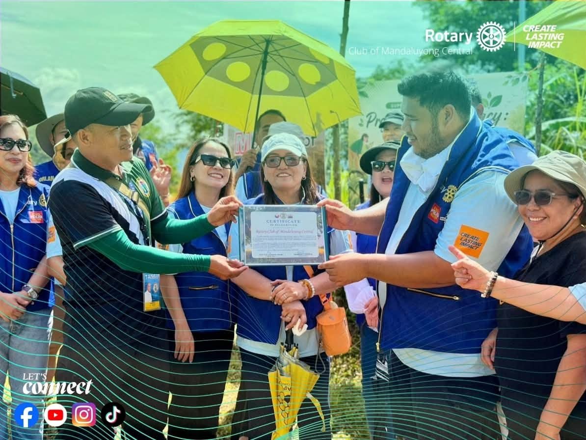 Municipal Environment and Natural Resources Office and RCMC volunteers with recognition certificate