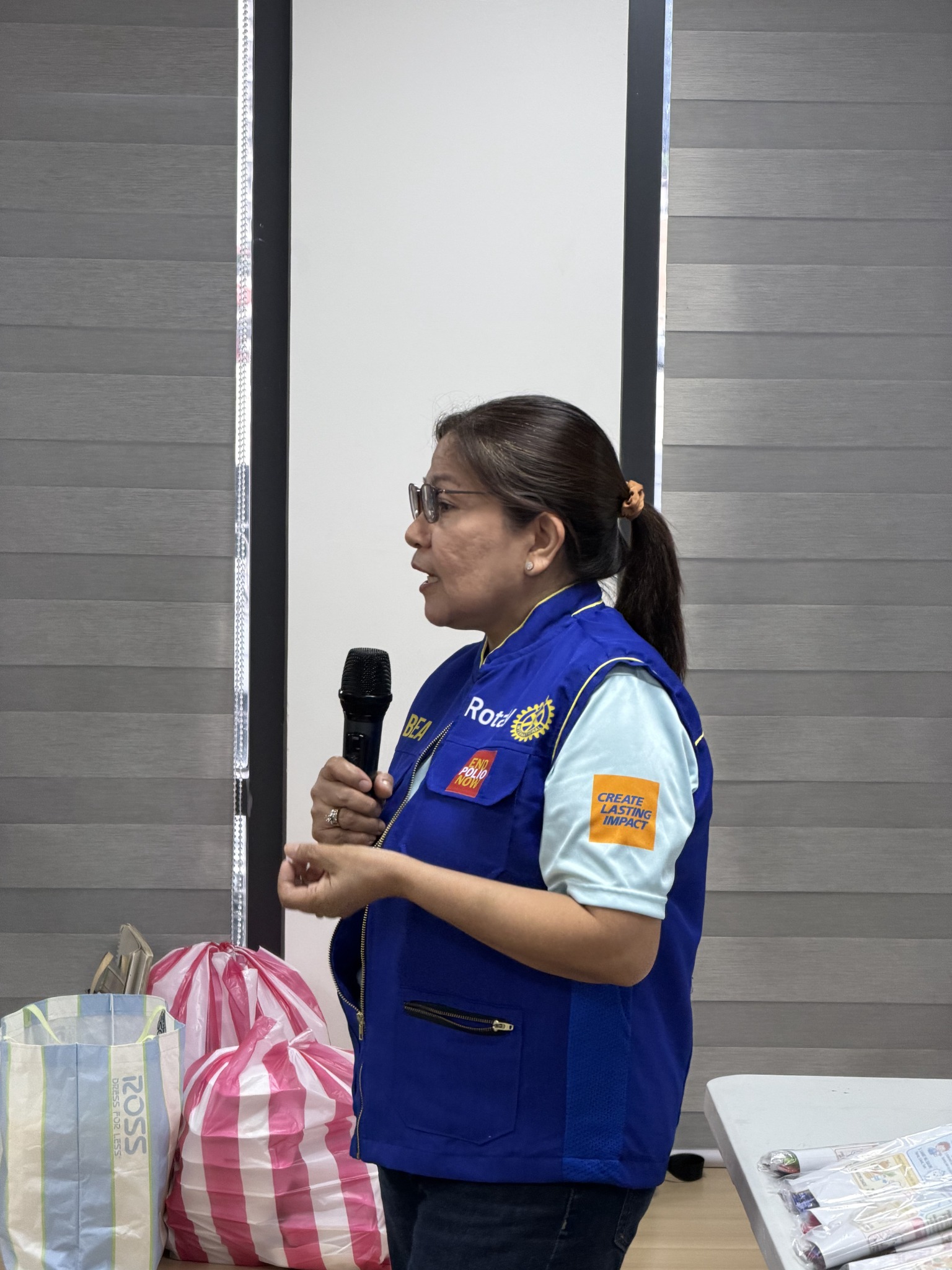 Rotary volunteer speaking during Brush Brush Hooray