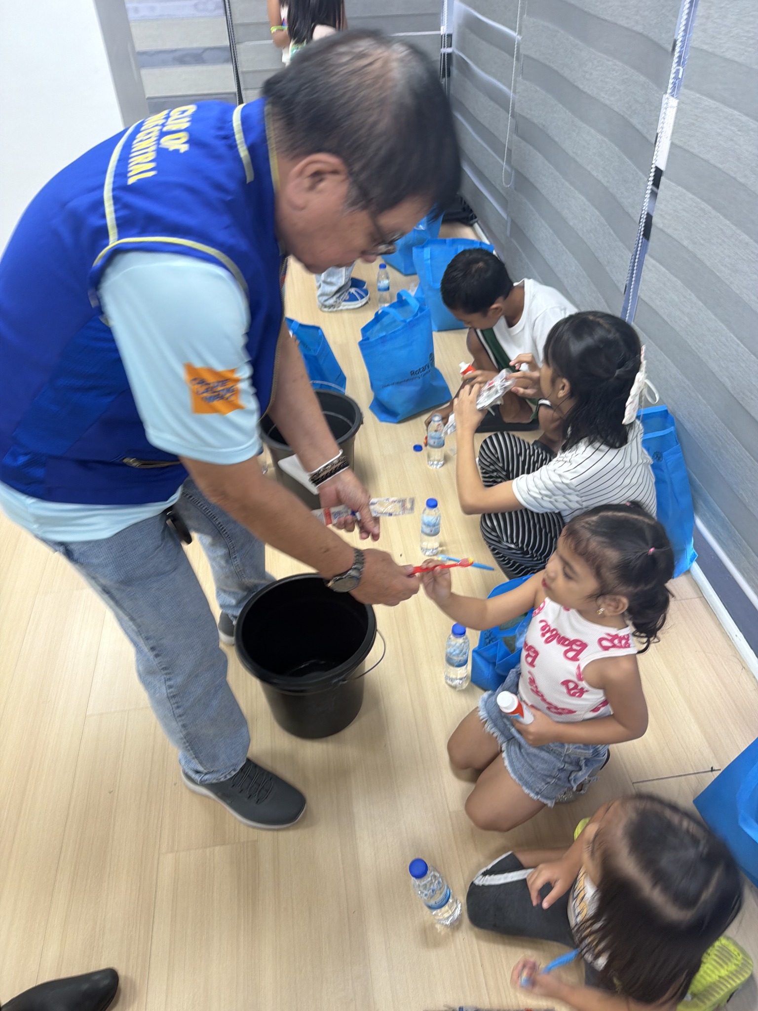 Child receiving a toothbrush during Brush Brush Hooray
