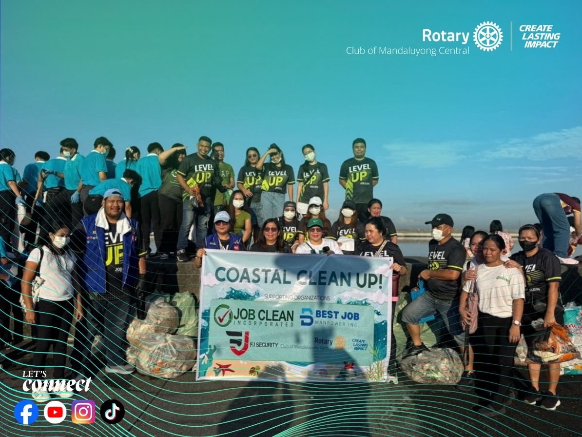 Rotary Club of Mandaluyong Central coastal cleanup group with collected waste