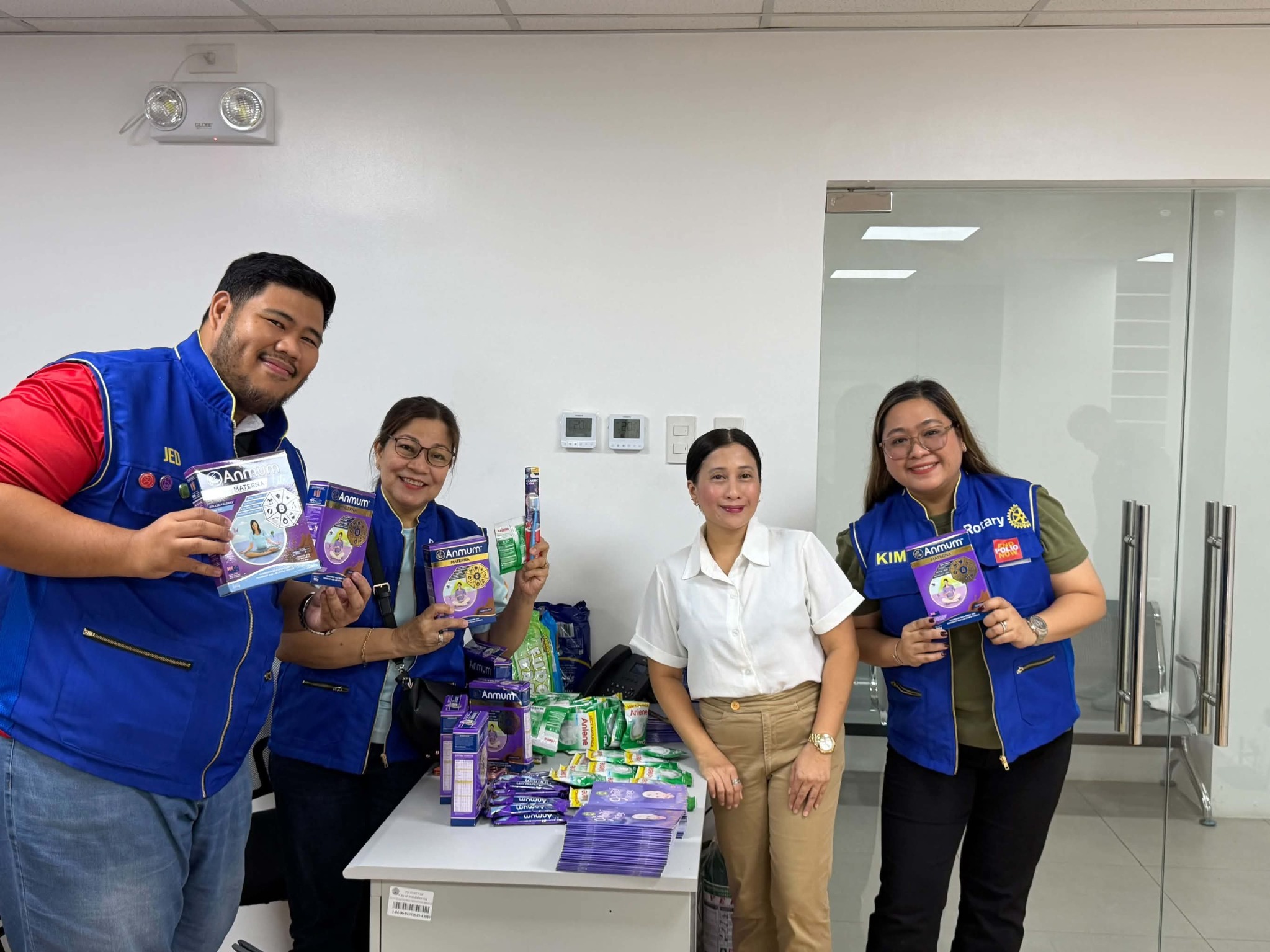 Rotary Club of Mandaluyong Central with maternal health learning materials and support products