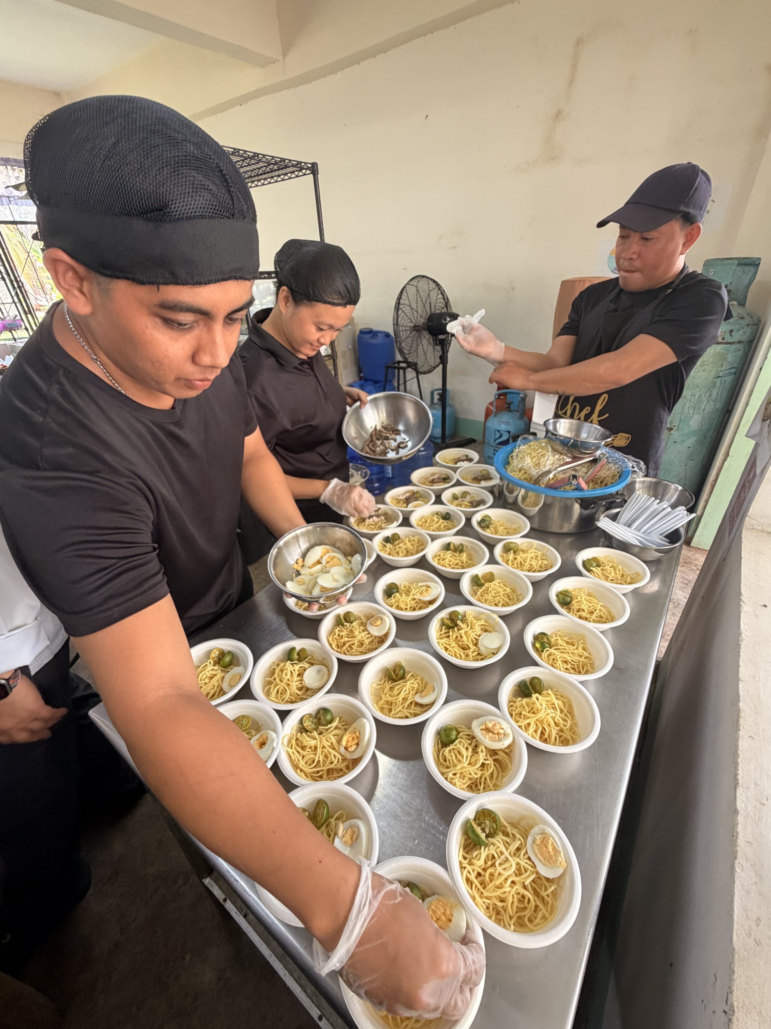 Culinary team preparing servings
